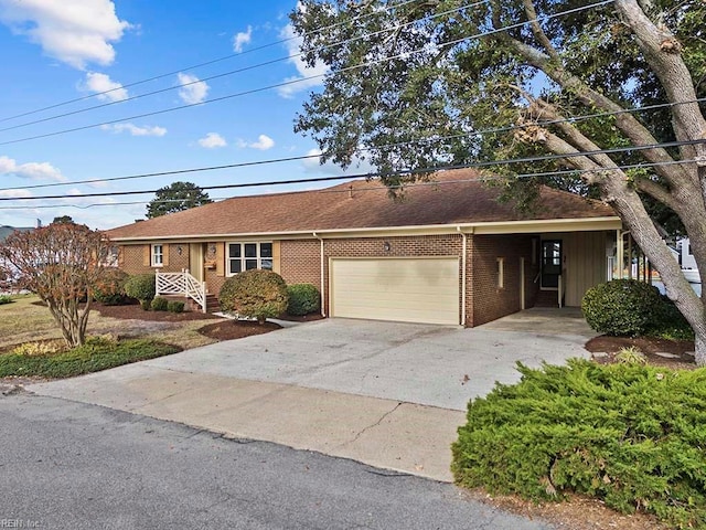 single story home featuring a garage and a carport