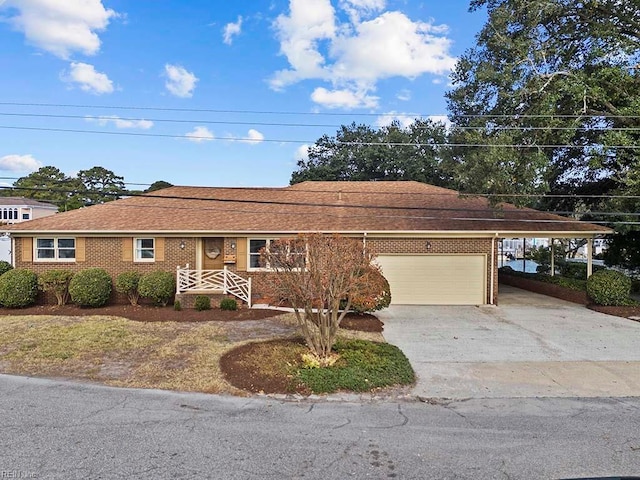 ranch-style house with a garage and a carport