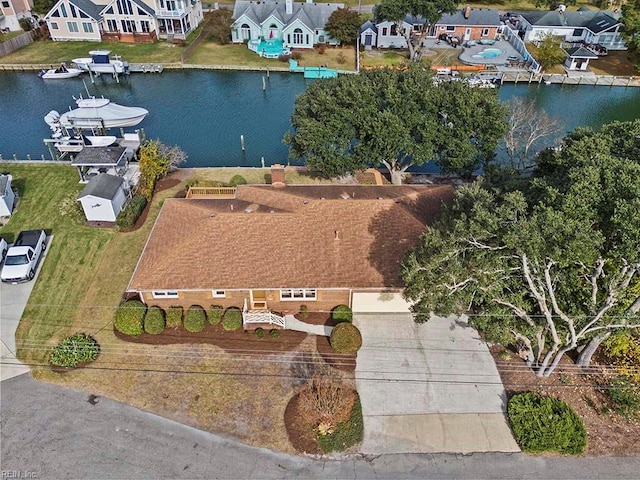 birds eye view of property featuring a water view