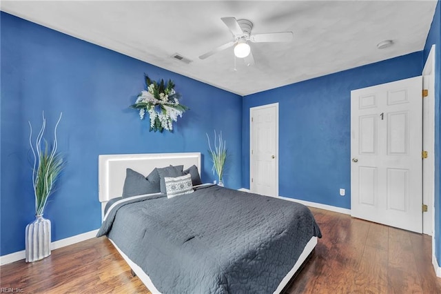 bedroom with hardwood / wood-style flooring and ceiling fan