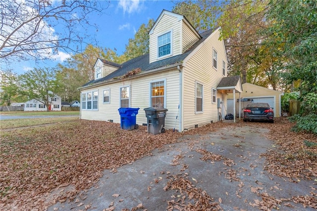 view of side of home with a garage