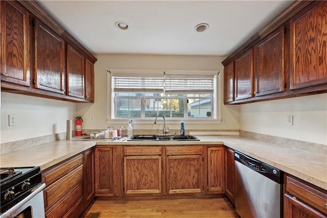 kitchen featuring light hardwood / wood-style flooring, sink, and stainless steel appliances