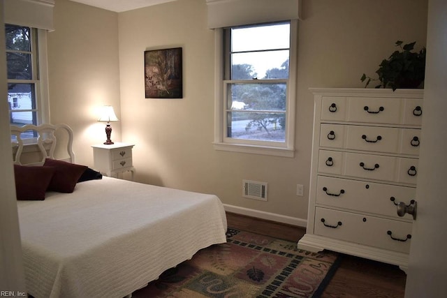 bedroom featuring dark hardwood / wood-style floors