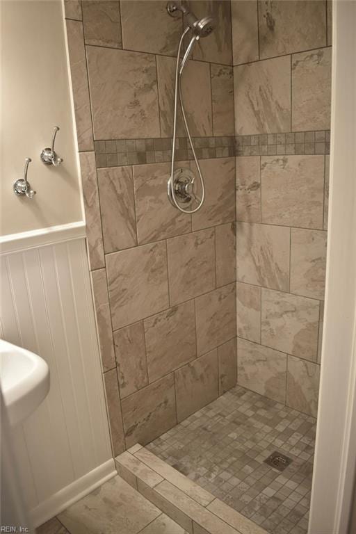 bathroom with a tile shower