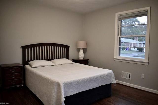 bedroom featuring dark hardwood / wood-style floors