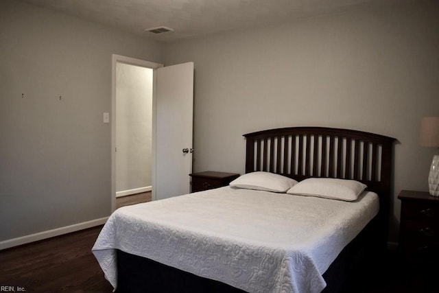 bedroom featuring dark wood-type flooring