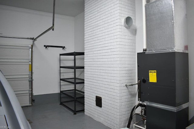 utility room featuring heating unit