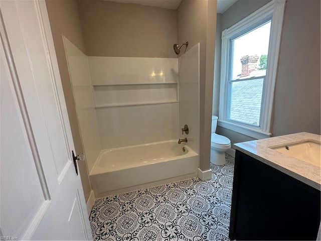 full bathroom featuring toilet, tub / shower combination, vanity, and tile patterned floors