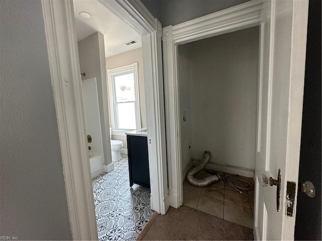 bathroom with vanity and tile patterned floors