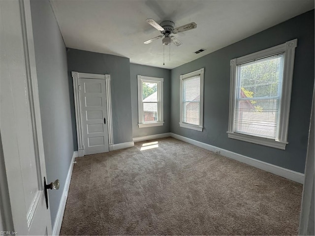 unfurnished bedroom featuring ceiling fan and carpet floors