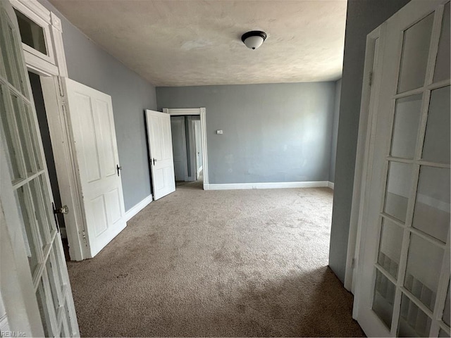 unfurnished bedroom featuring carpet flooring