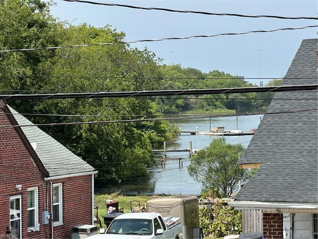 balcony featuring a dock and a water view