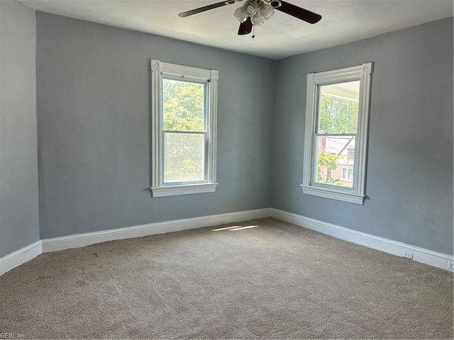 empty room featuring carpet and ceiling fan