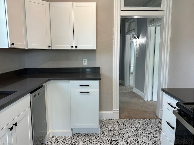 kitchen featuring white cabinetry, stainless steel dishwasher, and electric range