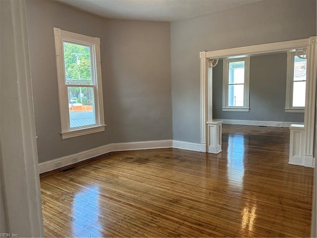 spare room featuring dark hardwood / wood-style floors