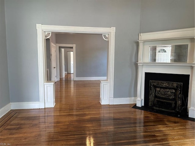 unfurnished living room with wood-type flooring