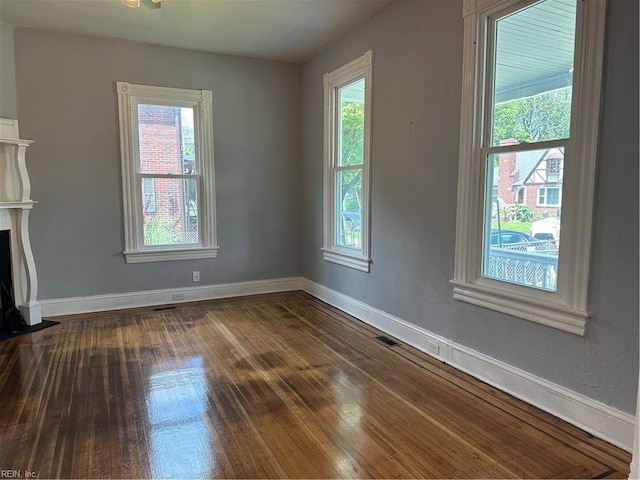 unfurnished living room featuring hardwood / wood-style flooring