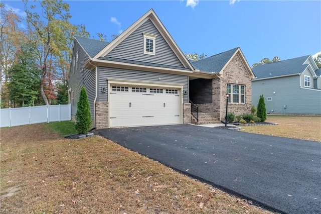 view of front facade featuring a garage and a front yard