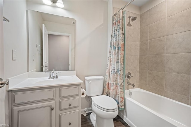 full bathroom with wood-type flooring, vanity, shower / bath combo, and toilet