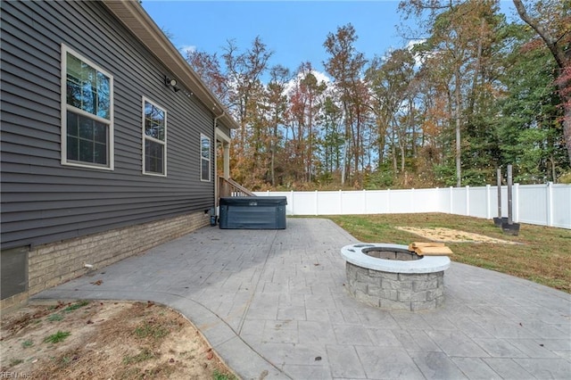 view of patio featuring a fire pit