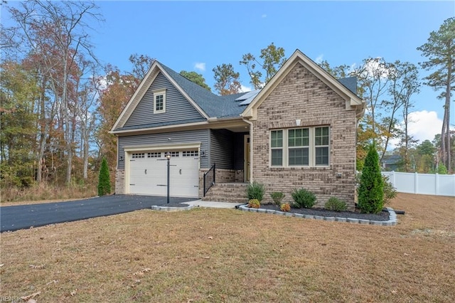 view of front facade featuring a garage and a front yard