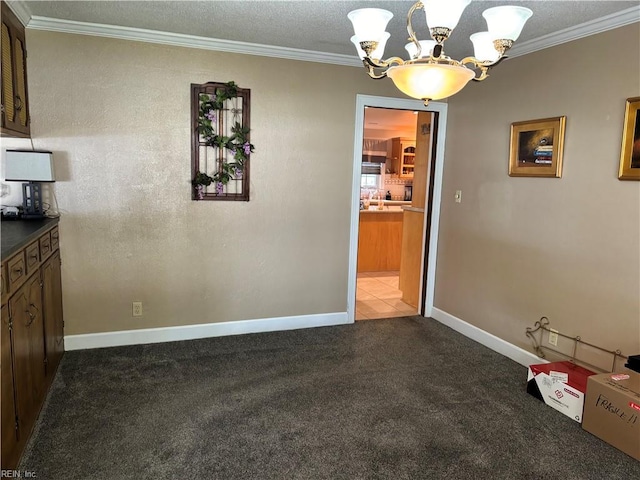 unfurnished dining area featuring a textured ceiling, a notable chandelier, dark carpet, and crown molding