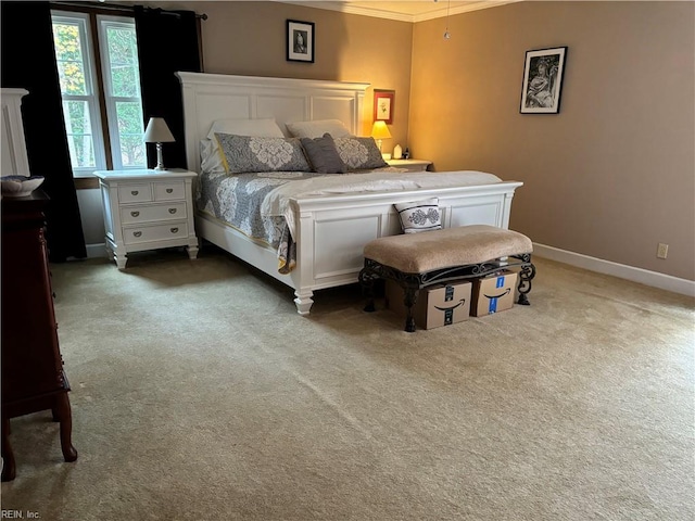 carpeted bedroom with crown molding