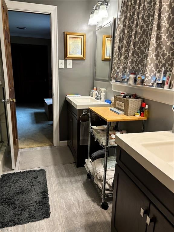 bathroom with vanity and hardwood / wood-style flooring