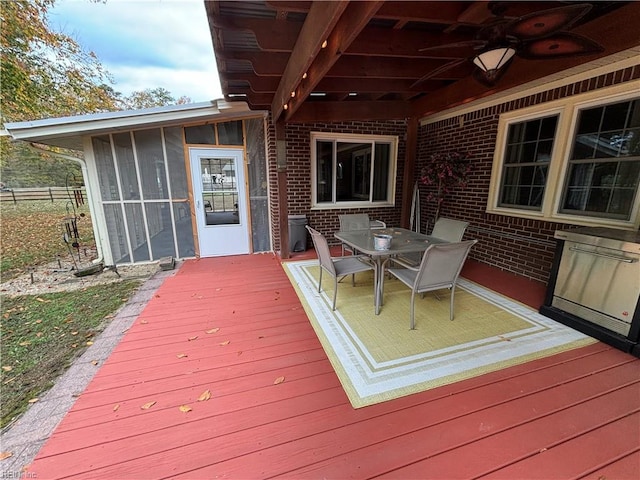 wooden deck featuring ceiling fan