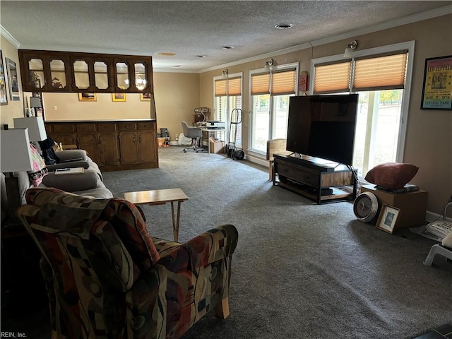 carpeted living room with plenty of natural light, ornamental molding, and a textured ceiling