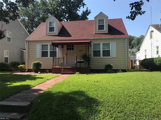 new england style home with a front lawn