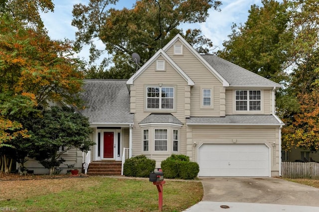 front of property featuring a garage and a front lawn