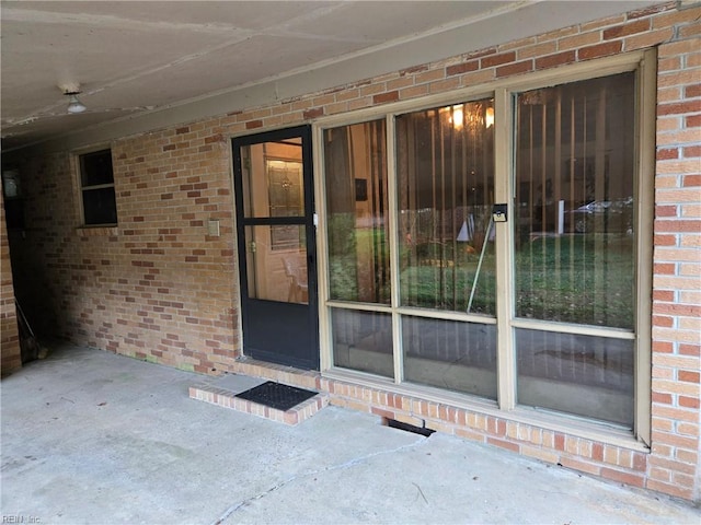 doorway to property featuring a patio area