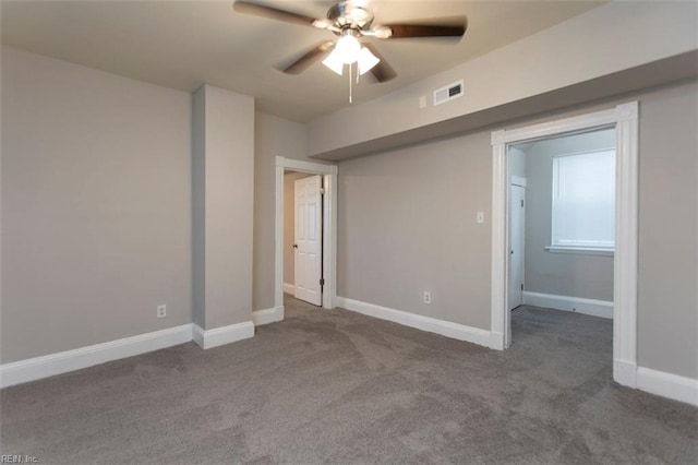 spare room with carpet and ceiling fan