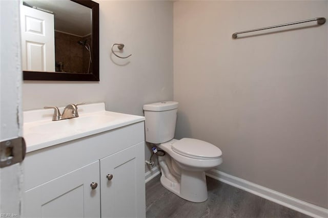228 Libby St, Hampton, VA 23663 - bathroom featuring baseboards, vanity, wood finished floors, and toilet