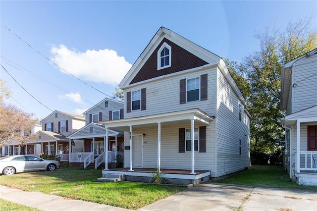 view of front of home featuring a porch and a front lawn