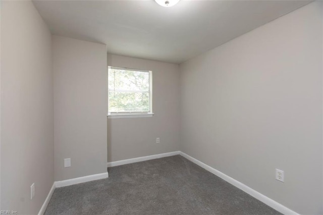 228 Libby St, Hampton, VA 23663 - empty room featuring dark carpet and baseboards