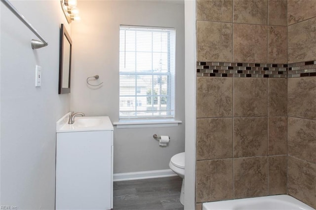 228 Libby St, Hampton, VA 23663 - full bathroom featuring vanity, toilet, baseboards, wood finished floors, and washtub / shower combination