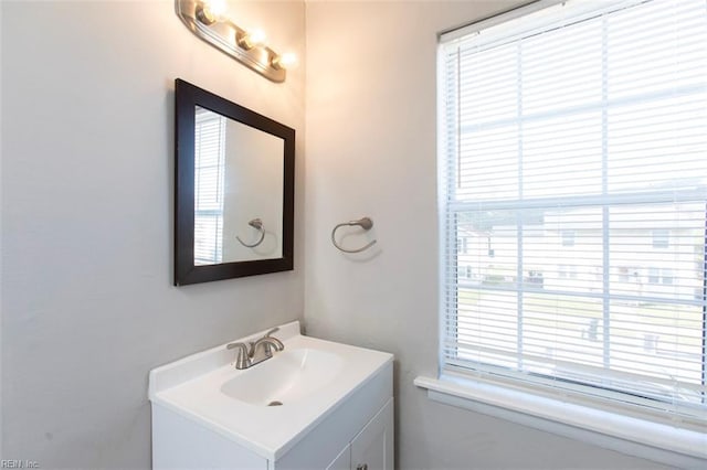 bathroom with vanity and plenty of natural light