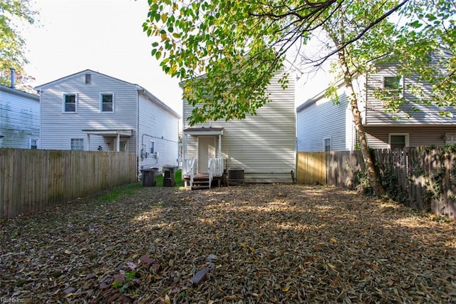 228 Libby St, Hampton, VA 23663 - rear view of house featuring a fenced backyard and central AC