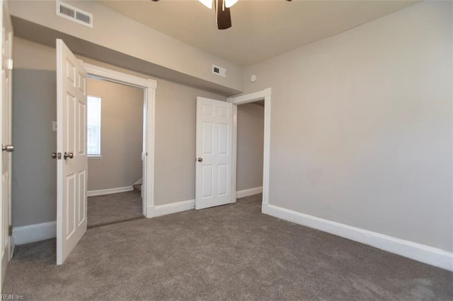 unfurnished bedroom featuring carpet floors, ceiling fan, and a closet