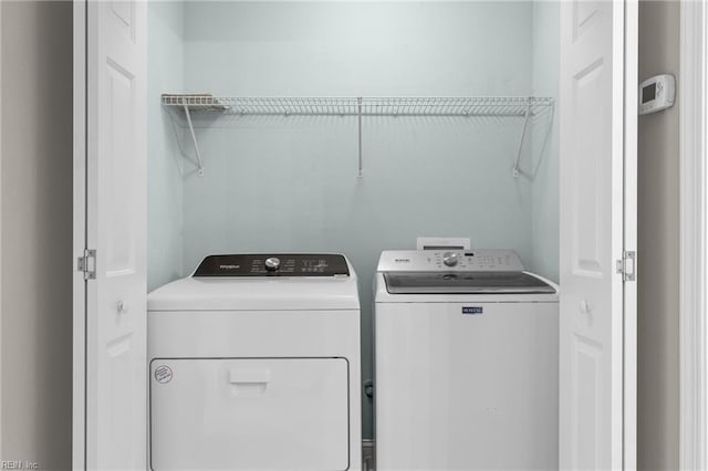 washroom with washer and clothes dryer