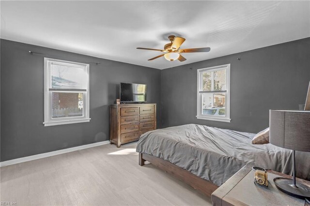 bedroom featuring light wood-type flooring and ceiling fan