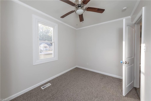 empty room featuring ceiling fan, light carpet, and ornamental molding