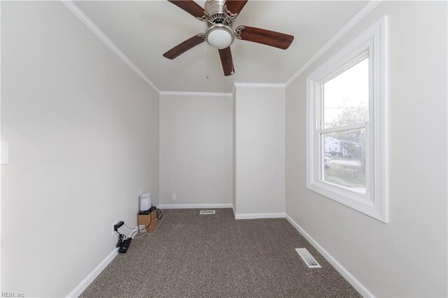 empty room with carpet floors, ceiling fan, and crown molding