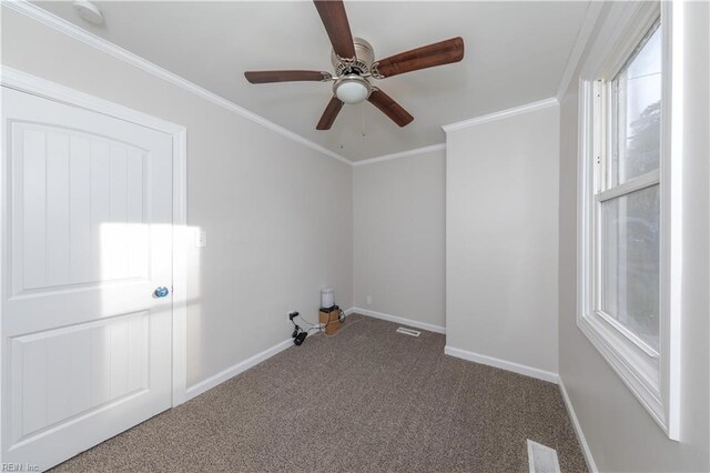 unfurnished room with carpet floors, ceiling fan, and crown molding