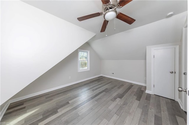 bonus room with vaulted ceiling, hardwood / wood-style flooring, and ceiling fan