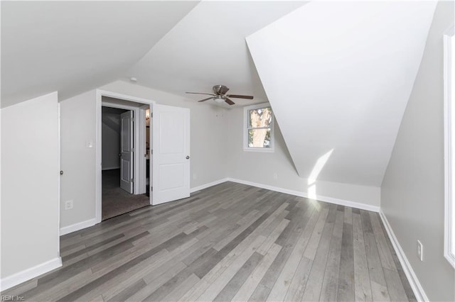 bonus room featuring vaulted ceiling, hardwood / wood-style flooring, and ceiling fan