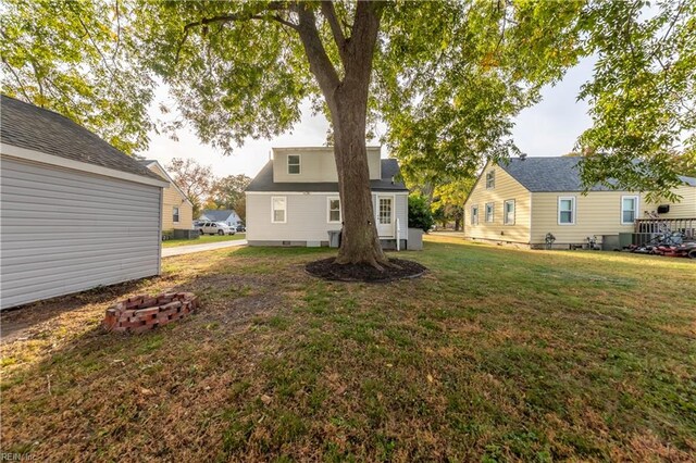 back of house with a yard