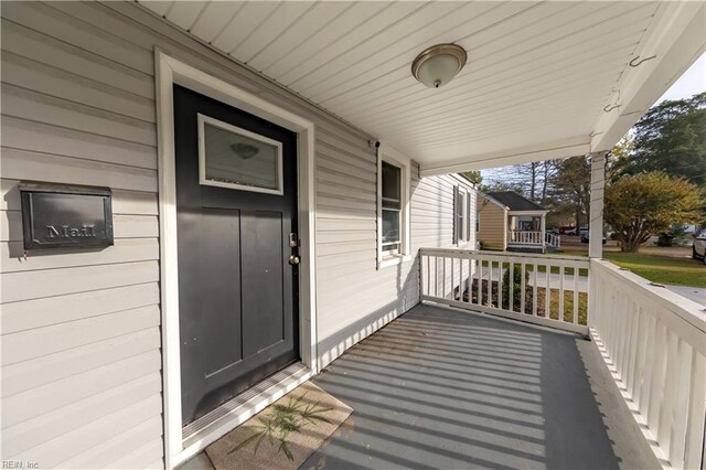 wooden terrace featuring a porch